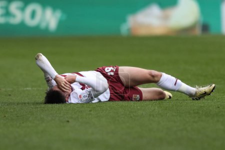 Photo for Kieron Bowie of Northampton Town goes down injured during the Sky Bet League 1 match Barnsley vs Northampton Town at Oakwell, Barnsley, United Kingdom, 27th April 202 - Royalty Free Image