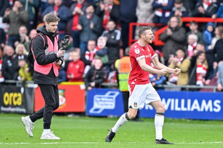 Photo for Paul Mullin of Wrexham celebrates the full time result, during the Sky Bet League 2 match Wrexham vs Stockport County at SToK Cae Ras, Wrexham, United Kingdom, 27th April 202 - Royalty Free Image