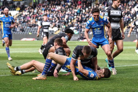 Photo for Riley Lumb of Leeds Rhinos goes over for a try to make it 4-4 on his debut during the Betfred Super League Round 9 match Hull FC vs Leeds Rhinos at MKM Stadium, Hull, United Kingdom, 28th April 202 - Royalty Free Image