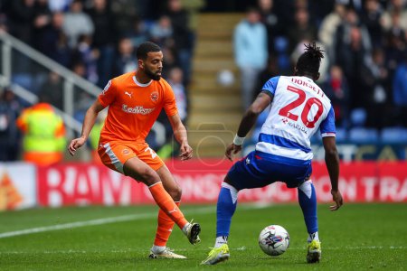 Photo for CJ Hamilton of Blackpool passes the ball during the Sky Bet League 1 match Reading vs Blackpool at Select Car Leasing Stadium, Reading, United Kingdom, 27th April 202 - Royalty Free Image