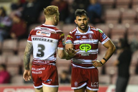 Photo for Adam Keighran of Wigan Warriors and Bevan French of Wigan Warriors hi 5 during the Betfred Super League Round 10 match Wigan Warriors vs Catalans Dragons at DW Stadium, Wigan, United Kingdom, 2nd May 2024 - Royalty Free Image