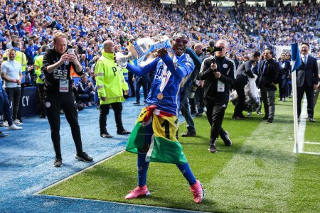 Photo for Abdul Fatawu of Leicester City celebrates with the championship trophy after the Sky Bet Championship match Leicester City vs Blackburn Rovers at King Power Stadium, Leicester, United Kingdom, 4th May 2024 - Royalty Free Image