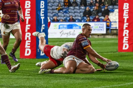 Photo for Tui Lolohea of Huddersfield Giants goes over for a try during the Betfred Super League Round 10 match Huddersfield Giants vs Salford Red Devils at John Smith's Stadium, Huddersfield, United Kingdom, 3rd May 2024 - Royalty Free Image