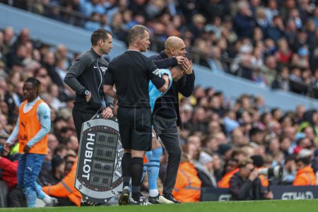 Photo for Pep Guardiola manager of Manchester City embraces John Stones of Manchester City as he prepares to be substituted on during the Premier League match Manchester City vs Wolverhampton Wanderers at Etihad Stadium, Manchester, United Kingdom, 4 May 2024 - Royalty Free Image