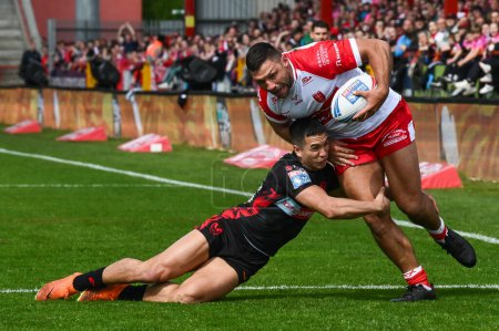 Photo for Ryan Hall of Hull KR is tackled by Tee Ritson of St. Helens during the Betfred Super League Round 10 match Hull KR vs St Helens at Sewell Group Craven Park, Kingston upon Hull, United Kingdom, 4th May 2024 - Royalty Free Image