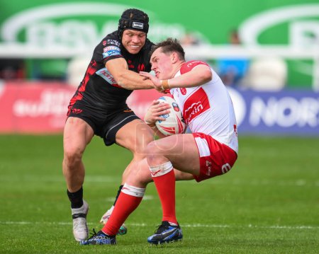 Photo for Jack Broadbent of Hull KR is tackled by Jonny Lomax of St. Helens during the Betfred Super League Round 10 match Hull KR vs St Helens at Sewell Group Craven Park, Kingston upon Hull, United Kingdom, 4th May 2024 - Royalty Free Image