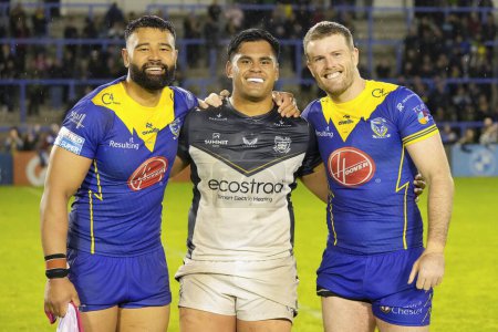 Photo for Zane Musgrove of Warrington Wolves and Lachlan Fitzgibbon of Warrington Wolves pose for photo with Herman Eseese of Hull FC after the Betfred Super League Round 10 match Warrington Wolves vs Hull FC at Halliwell Jones Stadium, Warrington - Royalty Free Image