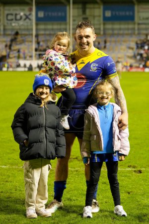 Photo for Sam Powell of Warrington Wolves poses for a photo with his family after the Betfred Super League Round 10 match Warrington Wolves vs Hull FC at Halliwell Jones Stadium, Warrington, United Kingdom, 3rd May 2024 - Royalty Free Image