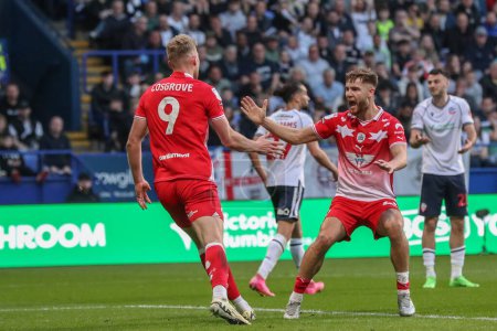Photo for Sam Cosgrove of Barnsley celebrates his goal to make it 0-1 during the Sky Bet League 1 Play-offs Semi-final second leg match Bolton Wanderers vs Barnsley at Toughsheet Community Stadium, Bolton, United Kingdom, 7th May 2024 - Royalty Free Image