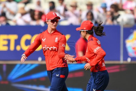 Photo for Maia Bouchier of England celebrates taking a catch with Freya Kemp of England during the First T20 International match England women vs Pakistan women at Edgbaston, Birmingham, United Kingdom, 11th May 2024 - Royalty Free Image