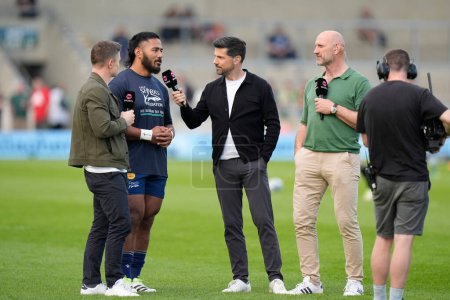 Photo for Sale Sharks centre Manu Tuilagi interviewed by Craig Doyle, Broadcaster TNT Sport with pundits Brian Driscoll and Laurence Dallaglio before Gallagher Premiership match Sale Sharks vs Leicester Tigers at Salford Stadium, United Kingdom, 10th May 2024 - Royalty Free Image