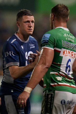 Photo for Sale Sharks full back Sam James shakes hands with Leicester Tigers flanker Hanro Liebenberg after playing last game for Sharks during Gallagher Premiership match Sale Sharks vs Leicester Tigers, Salford Stadium, Eccles, United Kingdom, 10th May 2024 - Royalty Free Image