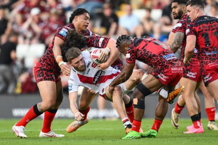 Photo for Ethan Ryan of Salford Red Devils is tackled by Edwin Ipape of Leigh Leopards during the Betfred Super League Round 11 match Leigh Leopards vs Salford Red Devils at Leigh Sports Village, Leigh, United Kingdom, 10th May 2024 - Royalty Free Image