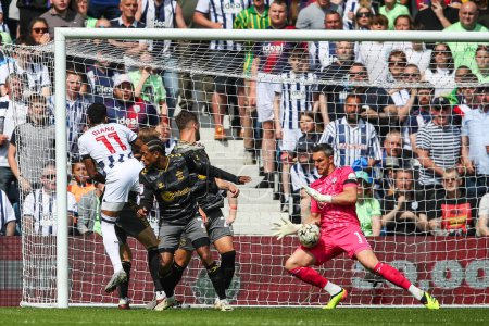 Photo for Alex McCarthy of Southampton saves a shot from Grady Diangana of West Bromwich Albion during the Bet Championship Play-Off Semi-Final First Leg match West Bromwich Albion vs Southampton at Hawthorns, West Bromwich, United Kingdom, 12th May 2024 - Royalty Free Image