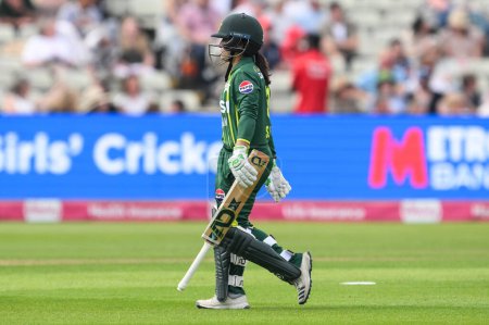 Photo for Sidra Amin of Pakistan leaves the field after being caught LBW off the bowling of Charlie Dean of England during the First T20 International match England women vs Pakistan women at Edgbaston, Birmingham, United Kingdom, 11th May 2024 - Royalty Free Image