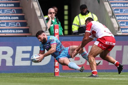 Photo for Abbas Miski of Wigan Warriors goes over for a try during the Betfred Challenge Cup Semi-Final Hull KR v Wigan Warriors at Eco-Power Stadium, Doncaster, United Kingdom, 18th May 2024 - Royalty Free Image