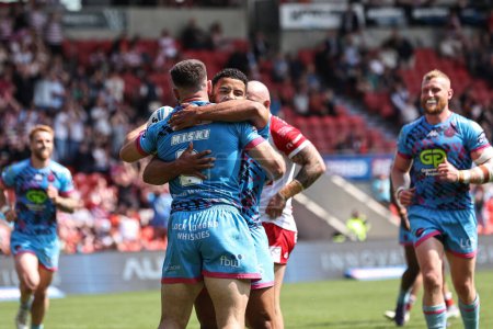 Photo for Abbas Miski of Wigan Warriors celebrates their try during the Betfred Challenge Cup Semi-Final Hull KR v Wigan Warriors at Eco-Power Stadium, Doncaster, United Kingdom, 18th May 2024 - Royalty Free Image