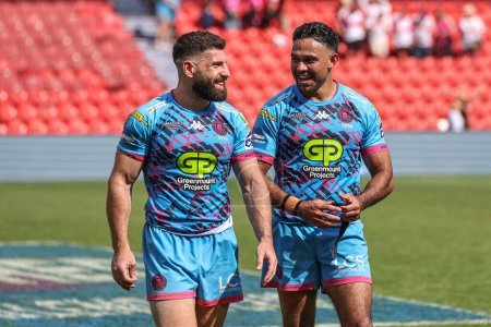 Photo for Abbas Miski of Wigan Warriors and Bevan French of Wigan Warriors celebrate their win during the Betfred Challenge Cup Semi-Final Hull KR v Wigan Warriors at Eco-Power Stadium, Doncaster, United Kingdom, 18th May 2024 - Royalty Free Image