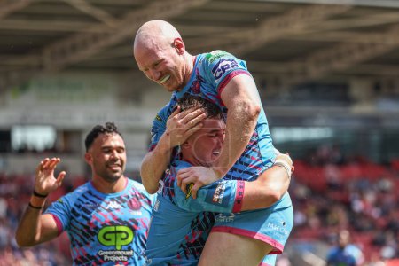 Photo for Harry Smith of Wigan Warriors celebrates their try during the Betfred Challenge Cup Semi-Final Hull KR v Wigan Warriors at Eco-Power Stadium, Doncaster, United Kingdom, 18th May 2024 - Royalty Free Image