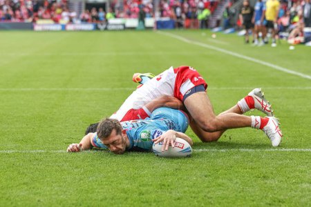 Photo for Jake Wardle of Wigan Warriors goes over for a try during the Betfred Challenge Cup Semi-Final Hull KR v Wigan Warriors at Eco-Power Stadium, Doncaster, United Kingdom, 18th May 2024 - Royalty Free Image