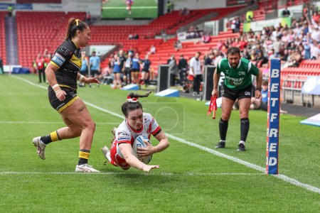 Photo for Leah Burke of St Helens goes over for a try during the Betfred Women's Challenge Cup match St Helens Women vs York City Knights Women at Eco-Power Stadium, Doncaster, United Kingdom, 18th May 2024 - Royalty Free Image