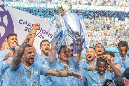 Photo for Kevin De Bruyne of Manchester City lifts the Premier League Trophy during the Premier League match Manchester City vs West Ham United at Etihad Stadium, Manchester, United Kingdom, 19th May 2024 - Royalty Free Image