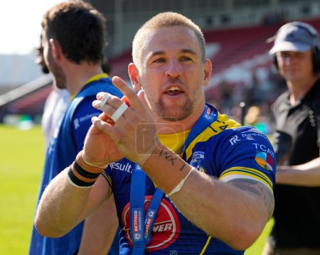 Photo for Matt Dufty of Warrington Wolves salutes the fans after winning man of the match during the Betfred Challenge Cup Semi-Final match Huddersfield Giants vs Warrington Wolves at Totally Wicked Stadium, St Helens, United Kingdom, 19th May 2024 - Royalty Free Image