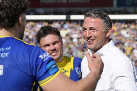 Photo for Sam Burgess, Head Coach celebrate with Joe Philbin and Toby King of Warrington Wolves after the Betfred Challenge Cup Semi-Final match Huddersfield Giants vs Warrington Wolves at Totally Wicked Stadium,  St Helens, United Kingdom, 19th May 2024 - Royalty Free Image