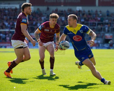 Photo for Matt Dufty of Warrington Wolves breaks through to score a try during the Betfred Challenge Cup Semi-Final match Huddersfield Giants vs Warrington Wolves at Totally Wicked Stadium, St Helens, United Kingdom, 19th May 2024 - Royalty Free Image