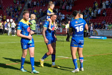 Photo for James Harrison, Paul Vaughan and Zane Musgrove of Warrington Wolves celebrate with their children after Betfred Challenge Cup Semi-Final match Huddersfield Giants vs Warrington Wolves at Totally Wicked Stadium, United Kingdom, 19th May 2024 - Royalty Free Image