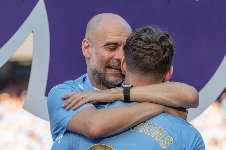 Photo for Pep Guardiola manager of Manchester City embraces John Stones of Manchester City  on there cheek during the Premier League match Manchester City vs West Ham United at Etihad Stadium, Manchester, United Kingdom, 19th May 2024 - Royalty Free Image