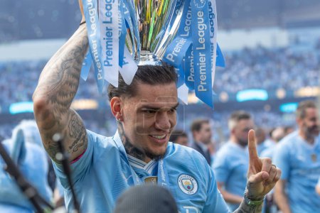 Photo for Ederson of Manchester City lifts the Premier League Trophy during the Premier League match Manchester City vs West Ham United at Etihad Stadium, Manchester, United Kingdom, 19th May 2024 - Royalty Free Image