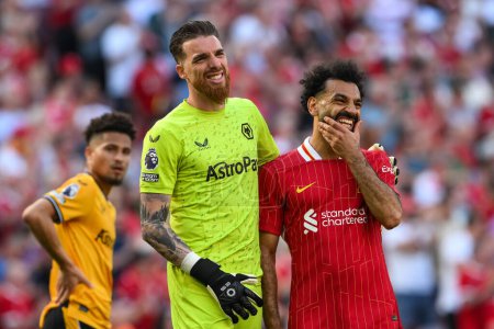 Photo for Jos S of Wolverhampton Wanderers and Mohamed Salah of Liverpool share a joke during the Premier League match Liverpool vs Wolverhampton Wanderers at Anfield, Liverpool, United Kingdom, 19th May 2024 - Royalty Free Image
