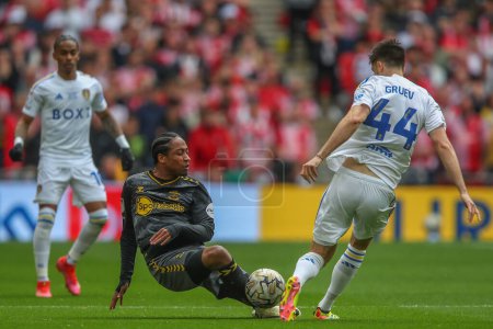 Photo for Kyle Walker-Peters of Southampton and Ilia Gruev of Leeds United battle for the ball during the Sky Bet Championship Play-Off Final match Leeds United vs Southampton at Wembley Stadium, London, United Kingdom, 26th May 2024 - Royalty Free Image
