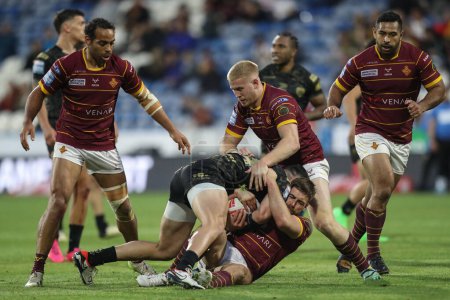 Photo for Luke Yates of Huddersfield Giants is tackled by Dan Norman of Leigh Leopards during the Betfred Super League Round 12 match Huddersfield Giants vs Leigh Leopards at John Smith's Stadium, Huddersfield, United Kingdom, 24th May 2024 - Royalty Free Image