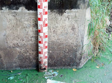 Photo for A water level scale measure the control door have a many dirty garbage. - Royalty Free Image