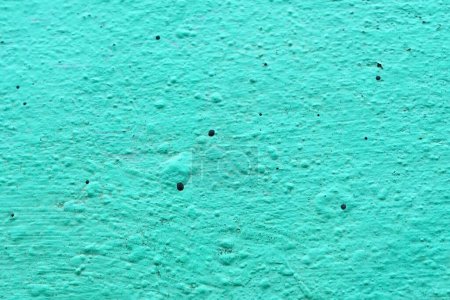 Téléchargez les photos : Une texture d'un mur de ciment rugueux peint en turquoise pour la texture et le design arrière-plan. - en image libre de droit