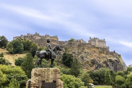 Photo for Edinburgh Castle is a historic castle in Edinburgh, Scotland. It stands on Castle Rock and is popular tourist attraction - Royalty Free Image