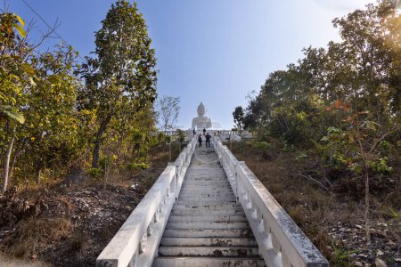 Photo for Tourists visiting Wat Phra That Mae Yen, or Big White Buddha is huge white Buddha stands on a hill with 353 steps, in Pai, popular tourist destination in Mae Hong Son, Thailand. - Royalty Free Image