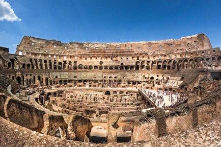 Foto de WIde angle view inside the ancient Colosseum, popular tourist destination in Rome, Italy - Imagen libre de derechos