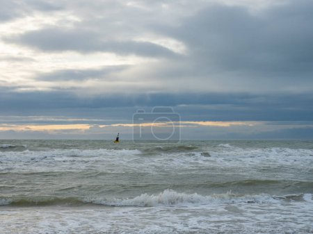 Photo for Situation at the beach of Oostende, Belgium: View into the open sea during cloudy weather. - Royalty Free Image