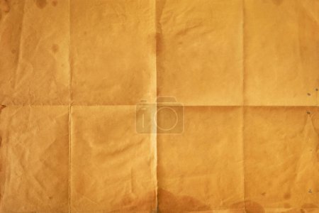 Foto de Primer plano del viejo bloc de notas naranja doblado en ocho, fondo de textura - Imagen libre de derechos