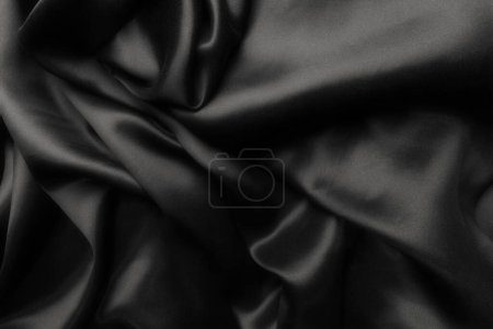 Foto de Elegante seda satinada negra con ondas, fondo abstracto - Imagen libre de derechos