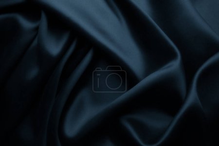 Foto de Elegante seda satinada azul con ondas, textura de fondo - Imagen libre de derechos