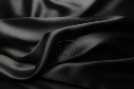 Foto de Elegante seda satinada negra con ondas, fondo abstracto - Imagen libre de derechos