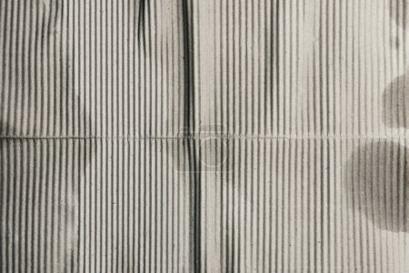 Téléchargez les photos : Gray striped old corrugated cardboard, background - en image libre de droit