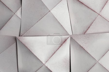 Photo for White paper sheets folded in geometric shapes - Royalty Free Image