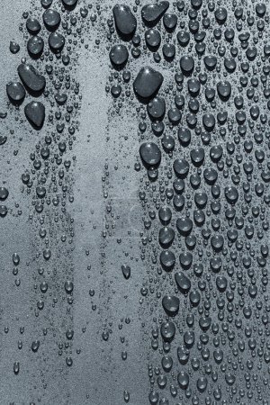 Foto de Gotas de agua sobre una superficie rugosa, fondo de textura - Imagen libre de derechos