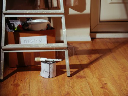 Photo for Redecorating kitchen with paint and stepladders wide shot selective focus - Royalty Free Image
