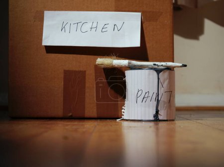 Photo for Paint for a new home with kitchen items in a box medium shot selective focus - Royalty Free Image